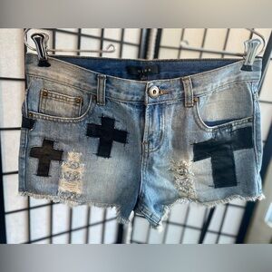 Size small denim shorts with black cross design; Never worn